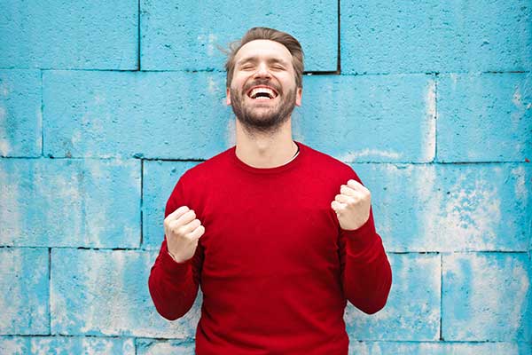 Man looking up and smiling in relief