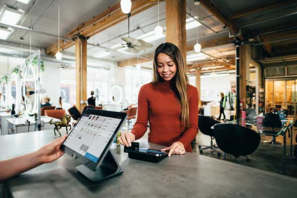 Woman paying at checkout